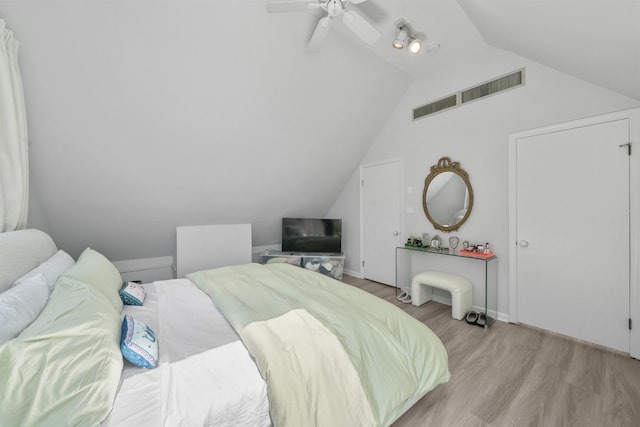 33 Duer Pl, Weehawken, NJ 07086 - bedroom with wood finished floors, vaulted ceiling, and ceiling fan