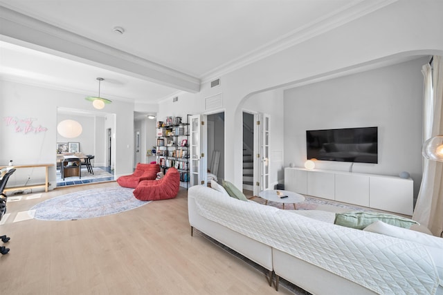 33 Duer Pl, Weehawken, NJ 07086 - living room featuring arched walkways, crown molding, wood finished floors, and stairway