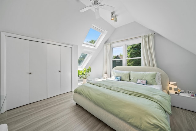 33 Duer Pl, Weehawken, NJ 07086 - bedroom featuring vaulted ceiling, a skylight, wood finished floors, a closet, and a ceiling fan