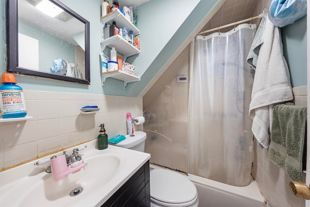 full bathroom with tile walls, vanity, toilet, and shower / bathtub combination with curtain