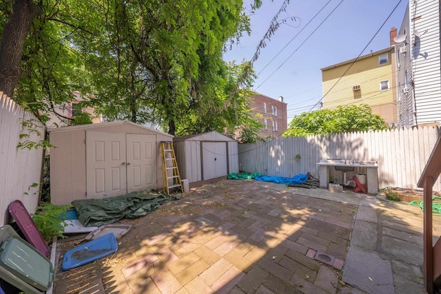 view of patio featuring a shed