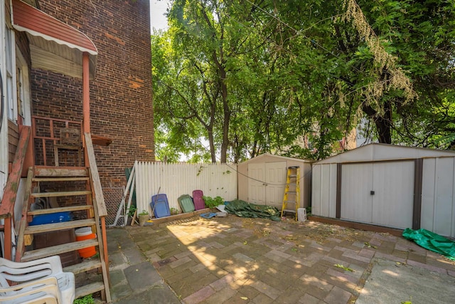 view of patio with a storage shed