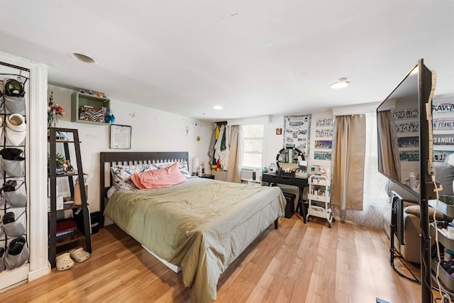 bedroom with light hardwood / wood-style flooring