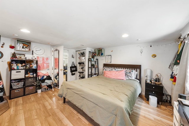 bedroom with hardwood / wood-style flooring