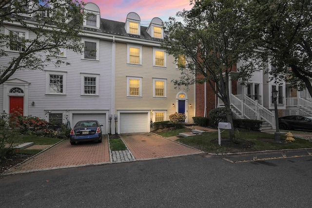 townhome / multi-family property featuring a garage