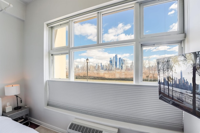 bedroom featuring a wall mounted air conditioner