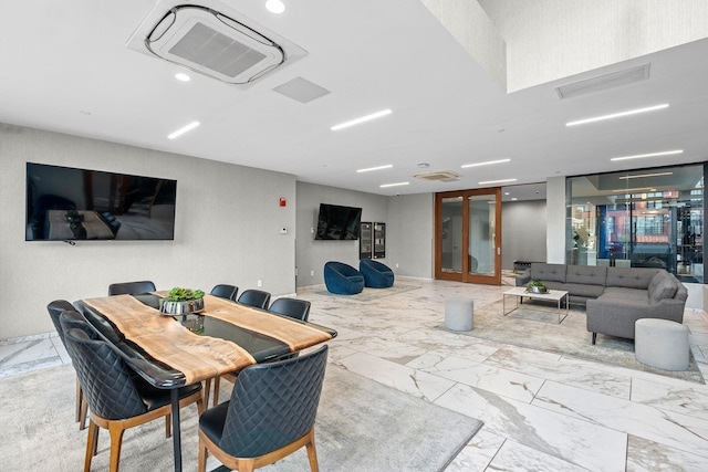 dining space with visible vents and marble finish floor