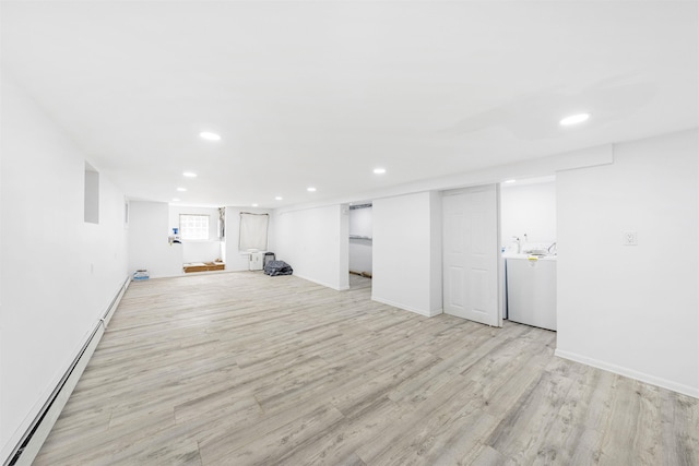 418 7th St, Union City, NJ 07087 - basement featuring recessed lighting, light wood-style floors, baseboard heating, and washer / dryer