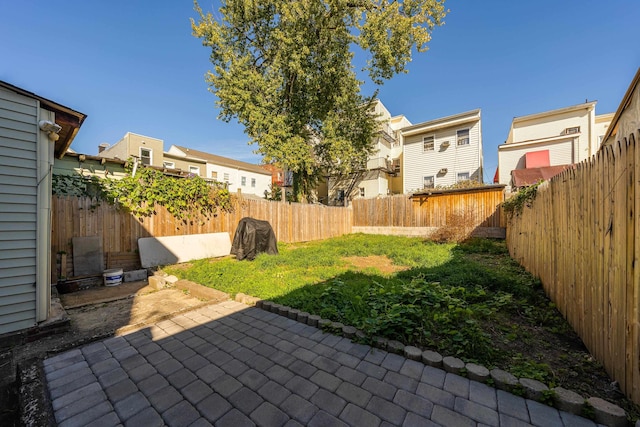 418 7th St, Union City, NJ 07087 - fenced backyard with a patio area and a residential view