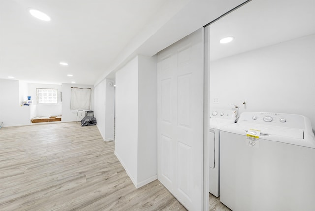 418 7th St, Union City, NJ 07087 - laundry area with light wood-type flooring, washer and clothes dryer, and recessed lighting