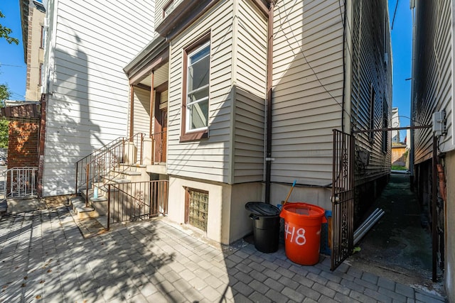 418 7th St, Union City, NJ 07087 - view of side of home with a patio area