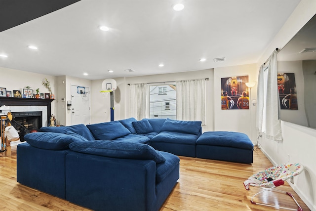 8901 Newkirk Ave, North Bergen, NJ 07047 - living area with light wood finished floors, recessed lighting, and a fireplace