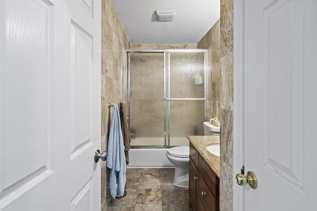 8901 Newkirk Ave, North Bergen, NJ 07047 - full bath with vanity, combined bath / shower with glass door, and stone finish floors