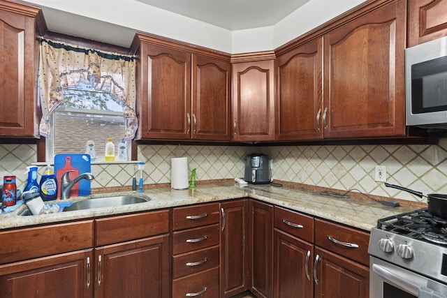 8901 Newkirk Ave, North Bergen, NJ 07047 - kitchen with appliances with stainless steel finishes, tasteful backsplash, and light stone counters