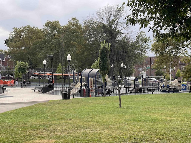 12 Audubon Ave Unit 305, Jersey City, NJ 07305 - view of property's community featuring a yard, fence, and playground community