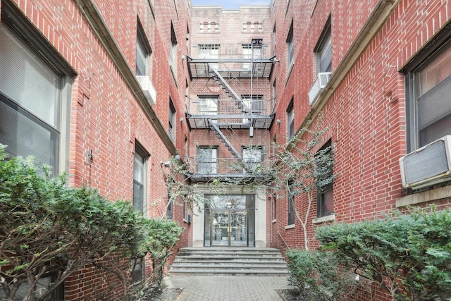 12 Audubon Ave Unit 305, Jersey City, NJ 07305 - view of exterior entry with french doors and brick siding