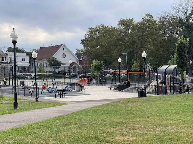 12 Audubon Ave Unit 305, Jersey City, NJ 07305 - view of property's community with playground community, a yard, and fence