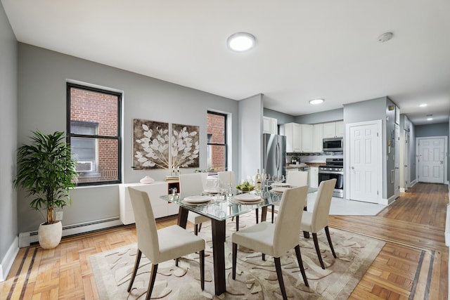 12 Audubon Ave Unit 305, Jersey City, NJ 07305 - dining room with a baseboard radiator and baseboards