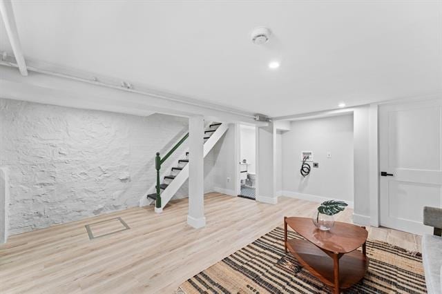 interior space with wood finished floors and recessed lighting