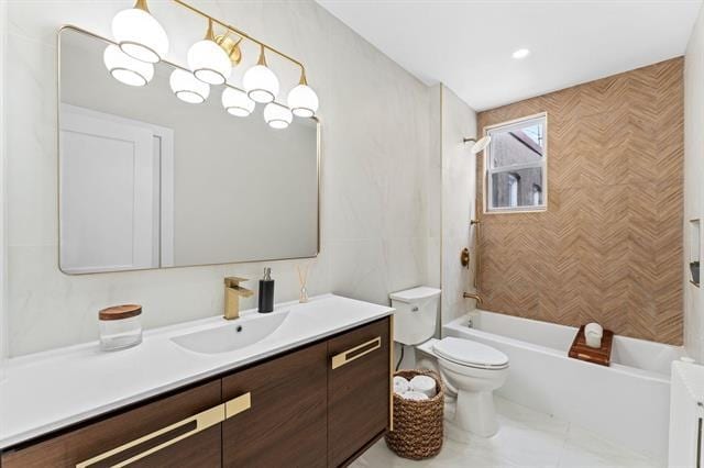 bathroom with toilet, shower / washtub combination, and vanity