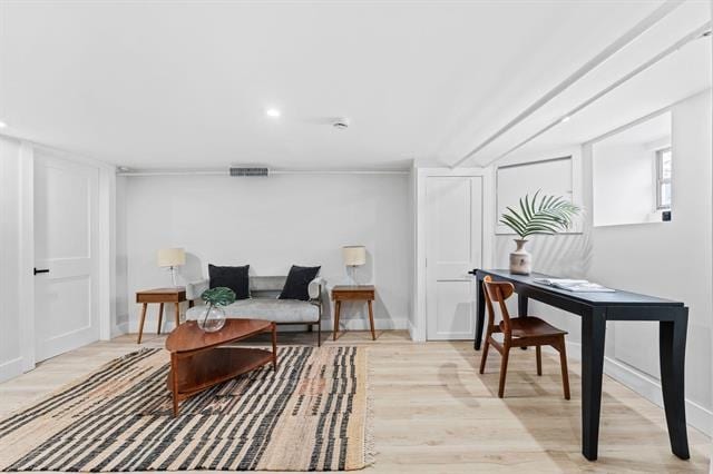 interior space with light wood-style floors, recessed lighting, visible vents, and baseboards