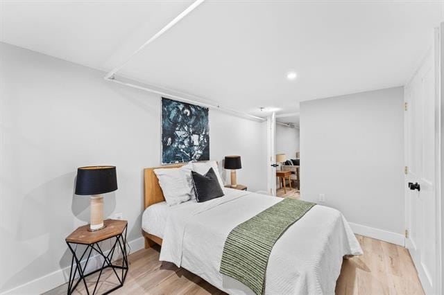 bedroom featuring recessed lighting, baseboards, and wood finished floors