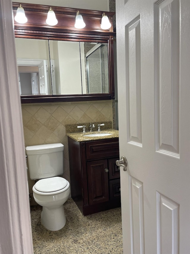 148 Nesbit St, Weehawken, NJ 07086 - bathroom featuring vanity, speckle patterned floor, and backsplash