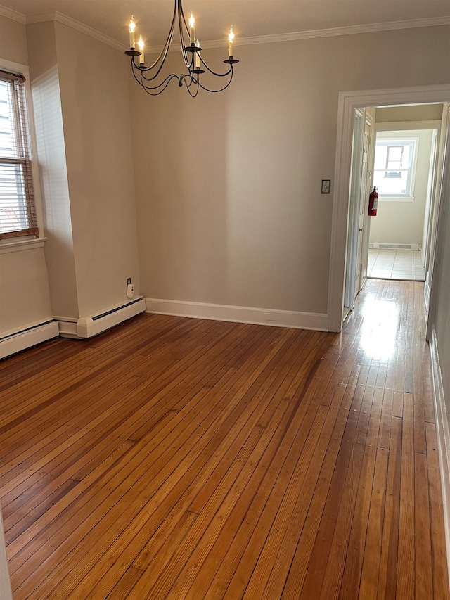 148 Nesbit St, Weehawken, NJ 07086 - spare room with a chandelier, wood-type flooring, and crown molding
