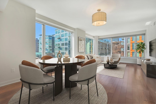 sunroom / solarium featuring a city view