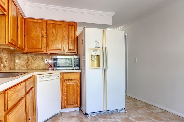 1445 68th St Unit A, North Bergen, NJ 07047 - kitchen with white appliances, crown molding, light countertops, tasteful backsplash, and brown cabinets