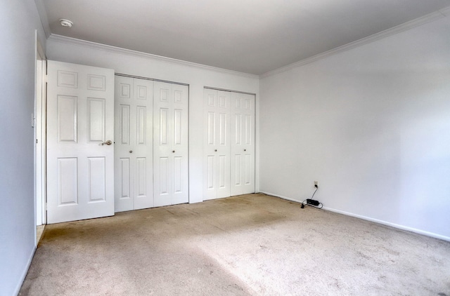 1445 68th St Unit A, North Bergen, NJ 07047 - unfurnished bedroom with two closets, carpet floors, and crown molding