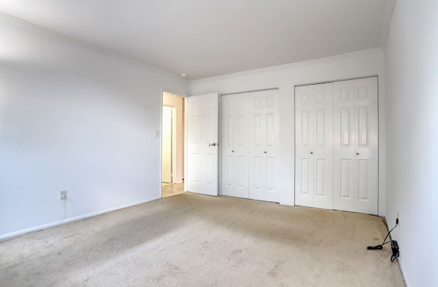 1445 68th St Unit A, North Bergen, NJ 07047 - unfurnished bedroom with two closets, carpet, and crown molding