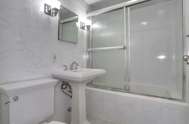 1445 68th St Unit A, North Bergen, NJ 07047 - full bathroom featuring bath / shower combo with glass door and tile walls