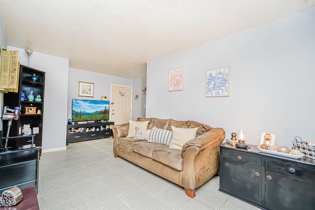 living area featuring light tile patterned flooring