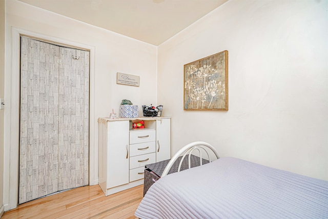 bedroom with light wood finished floors