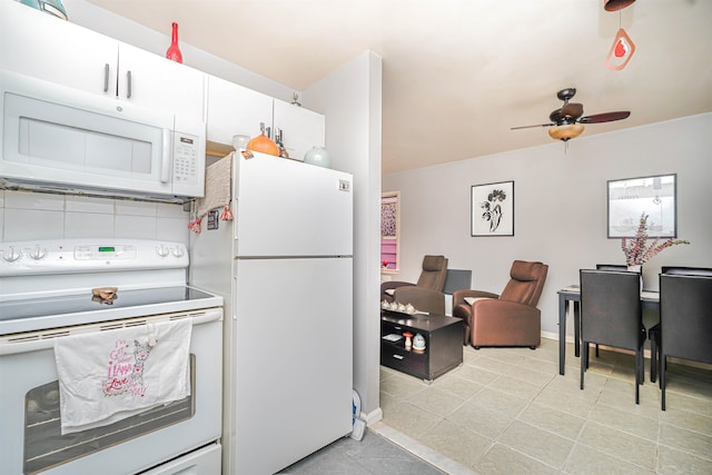kitchen featuring white cabinets, light tile patterned flooring, white appliances, a ceiling fan, and baseboards
