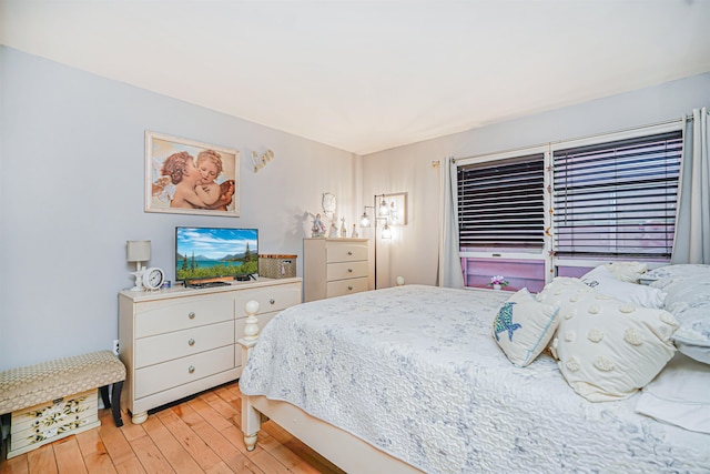 bedroom with light wood-style floors