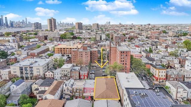 birds eye view of property with a view of city