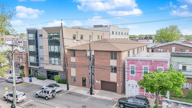 view of building exterior with uncovered parking