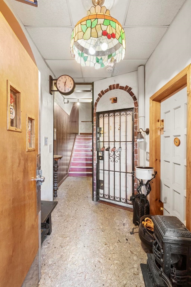 foyer featuring a drop ceiling