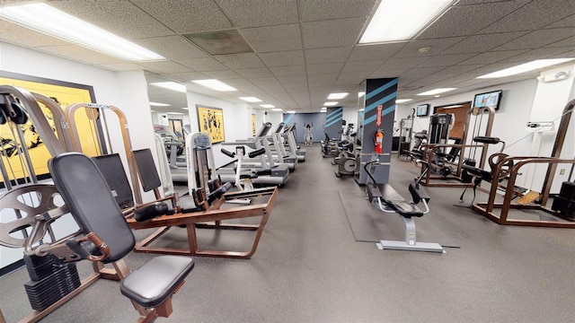 gym featuring a drop ceiling