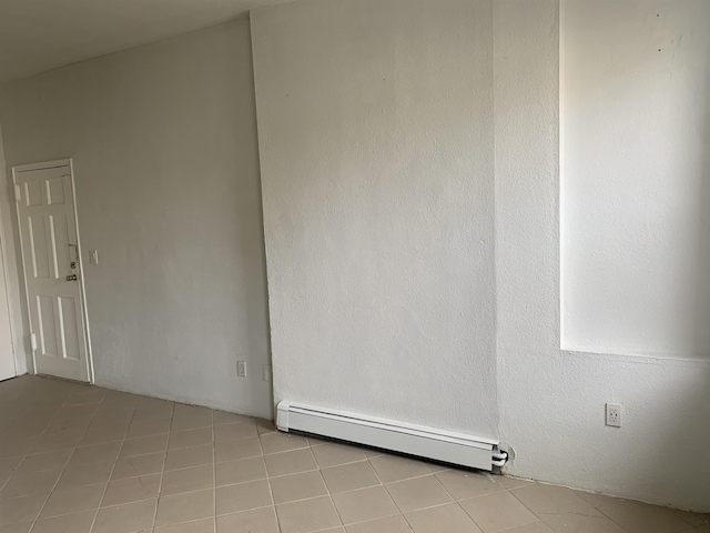 spare room with a baseboard heating unit