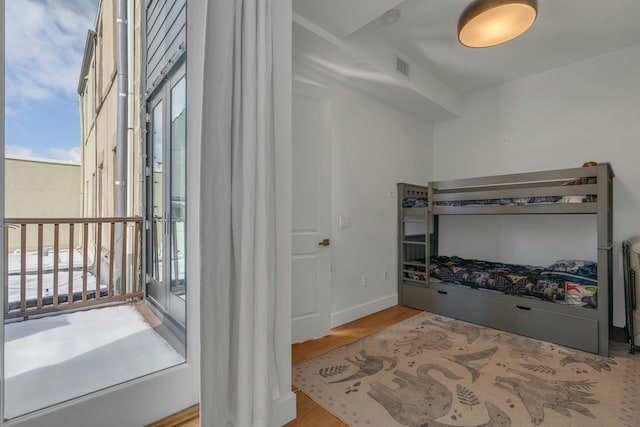 157 8th St, Hoboken, NJ 07030 - bedroom featuring wood finished floors and baseboards