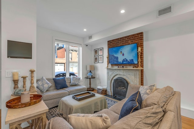 157 8th St, Hoboken, NJ 07030 - living area featuring wood finished floors, recessed lighting, and a brick fireplace