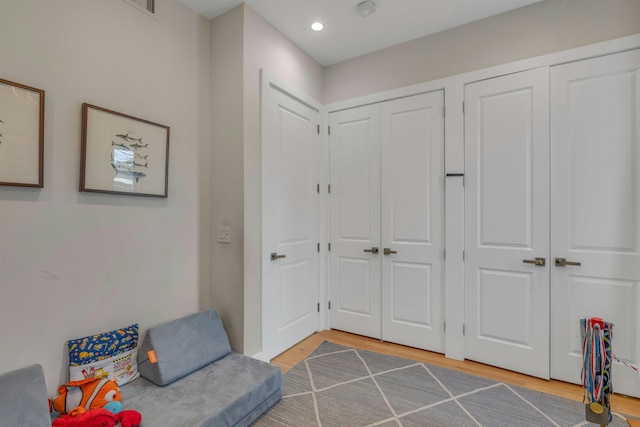 157 8th St, Hoboken, NJ 07030 - sitting room with light wood-style floors and recessed lighting