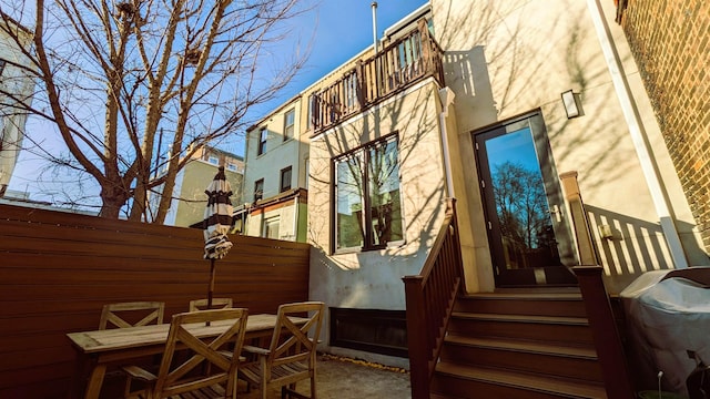 157 8th St, Hoboken, NJ 07030 - view of property exterior with a patio, stucco siding, and a balcony