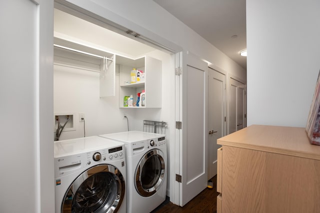 laundry room featuring dark hardwood / wood-style floors and washing machine and clothes dryer