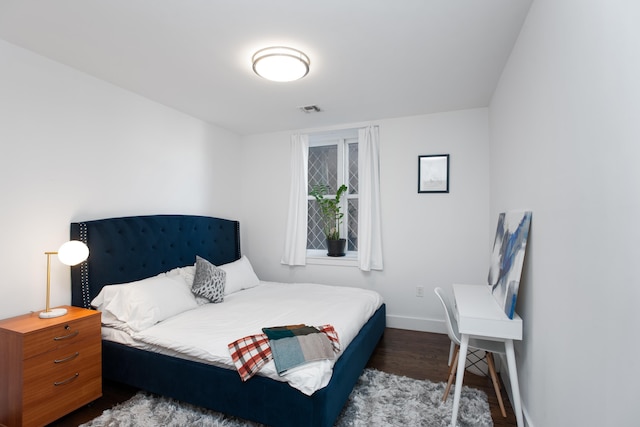 bedroom featuring dark hardwood / wood-style floors