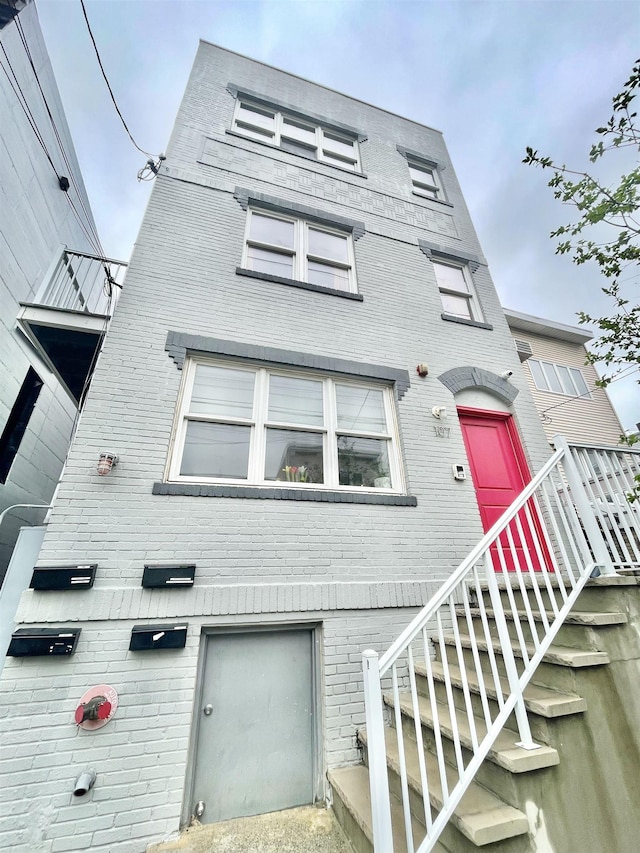 view of front of property featuring brick siding