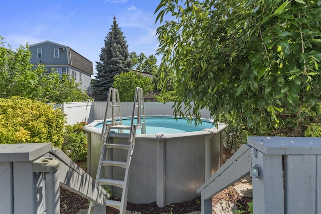 104 W 52nd St, Bayonne, NJ 07002 - view of swimming pool with a fenced backyard